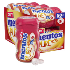 Mentos Pure Fresh Cinnamon bottle on desk for on-the-go freshness.