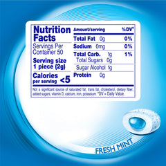 Mentos Pure Fresh curvy bottle on a desk for quick, portable mint refresh.