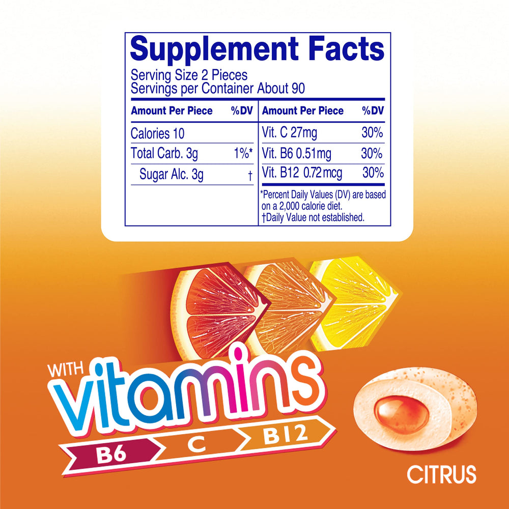 Mentos Vitamins Citrus gum piece closeup highlighting crunchy shell and soft center.
