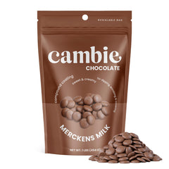 Merckens milk melts close-up showing creamy texture ideal for glossy chocolate coating