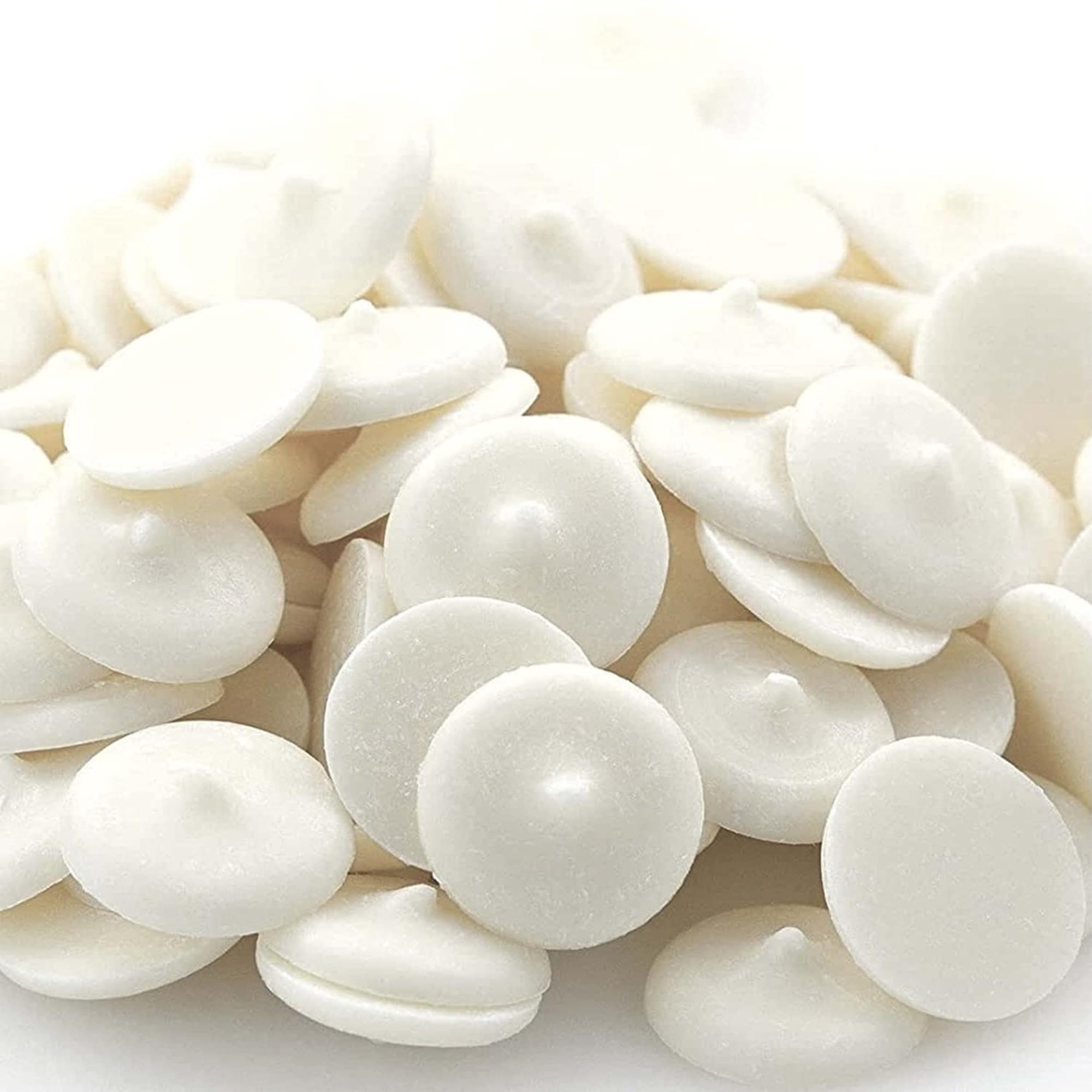 Merckens white chocolate wafers ideal for dipping pretzels and fruits with even coating.