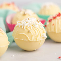Merckens White coating ready for dipping caramel apples and treats