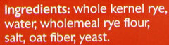 Close-up of whole rye kernels in Mestemacher bread, highlighting natural grains.