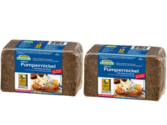 Mestemacher whole grain pumpernickel bread loaf on cutting board, fiber-rich and perfect for wholesome toast.