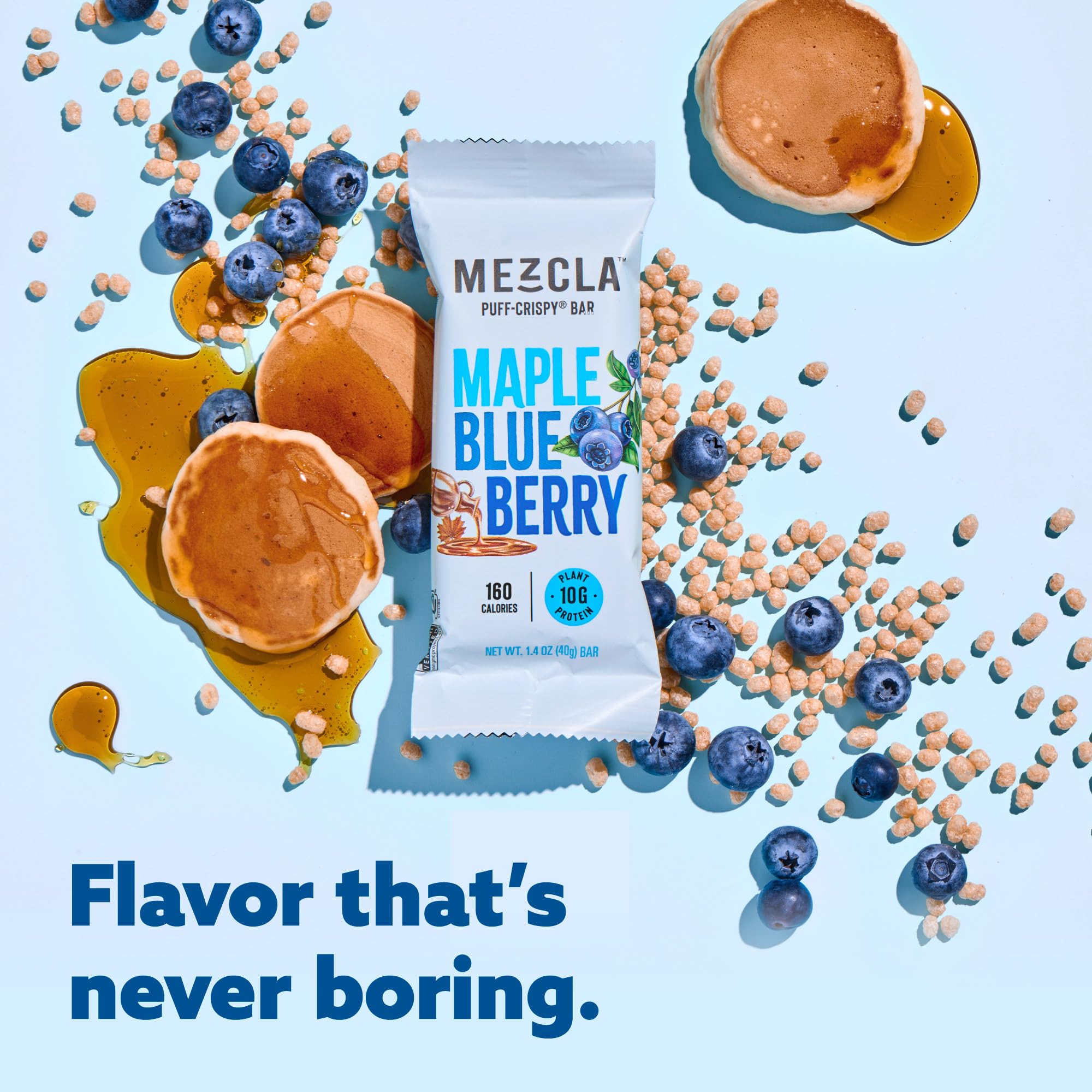 Mezcla Puff Crispy Maple-Blueberry bar broken in half to show texture.