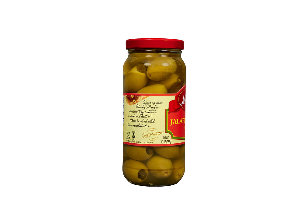 Cocktail glass with olives, perfect garnish.