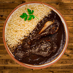 Mi Mole served over chicken tacos for a vibrant dinner.