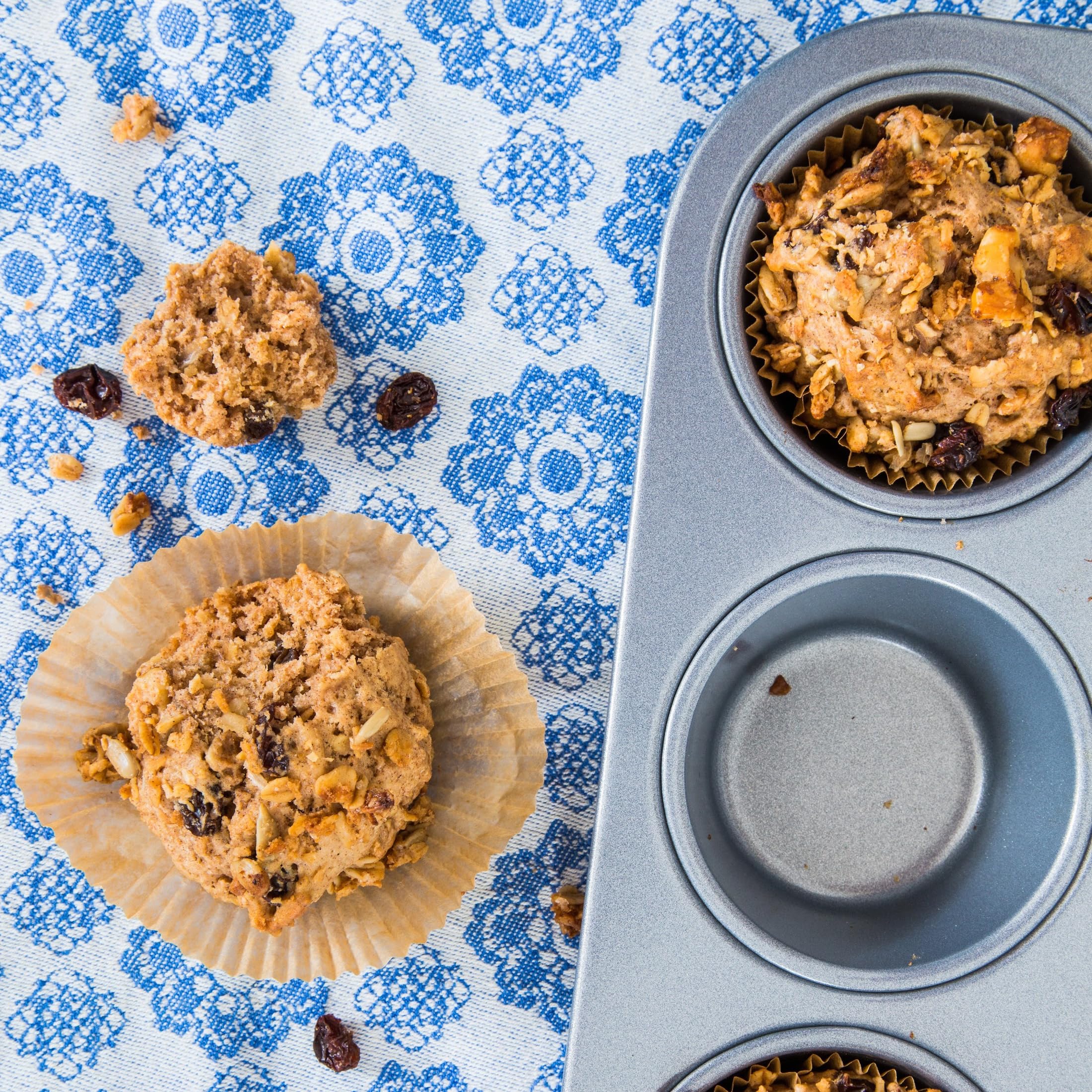 Michele’s Granola Cinnamon Raisin packaging jar highlighting Non-GMO, gluten-free ingredients.