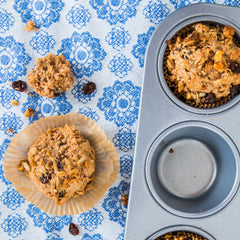 Michele’s Granola Cinnamon Raisin packaging jar highlighting Non-GMO, gluten-free ingredients.