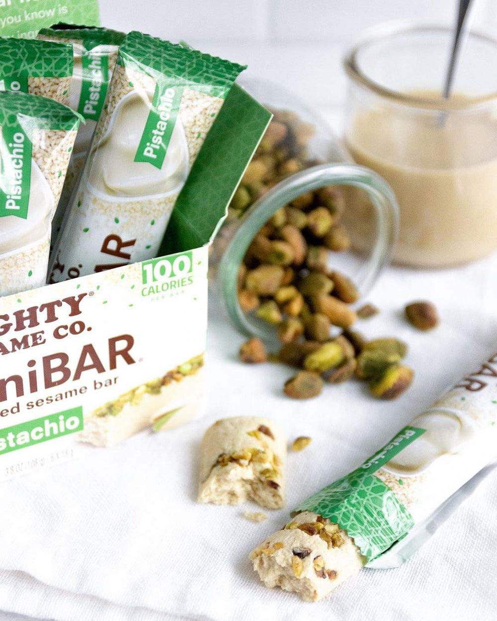 Mighty Sesame TahiniBars Vanilla Pistachio Cocoa Nibs variety in pack offers tasty snack options.