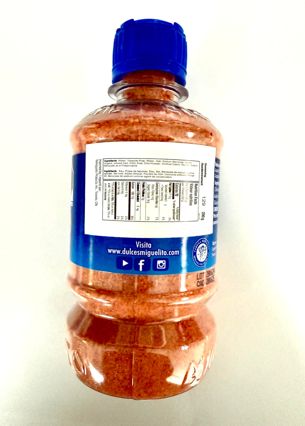 Miguelito chili powder bottles ready for easy seasoning on fruits.