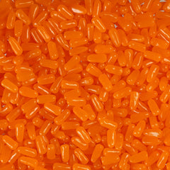 Mike and Ike Orange candies in bright color, close-up view highlights chewy texture.