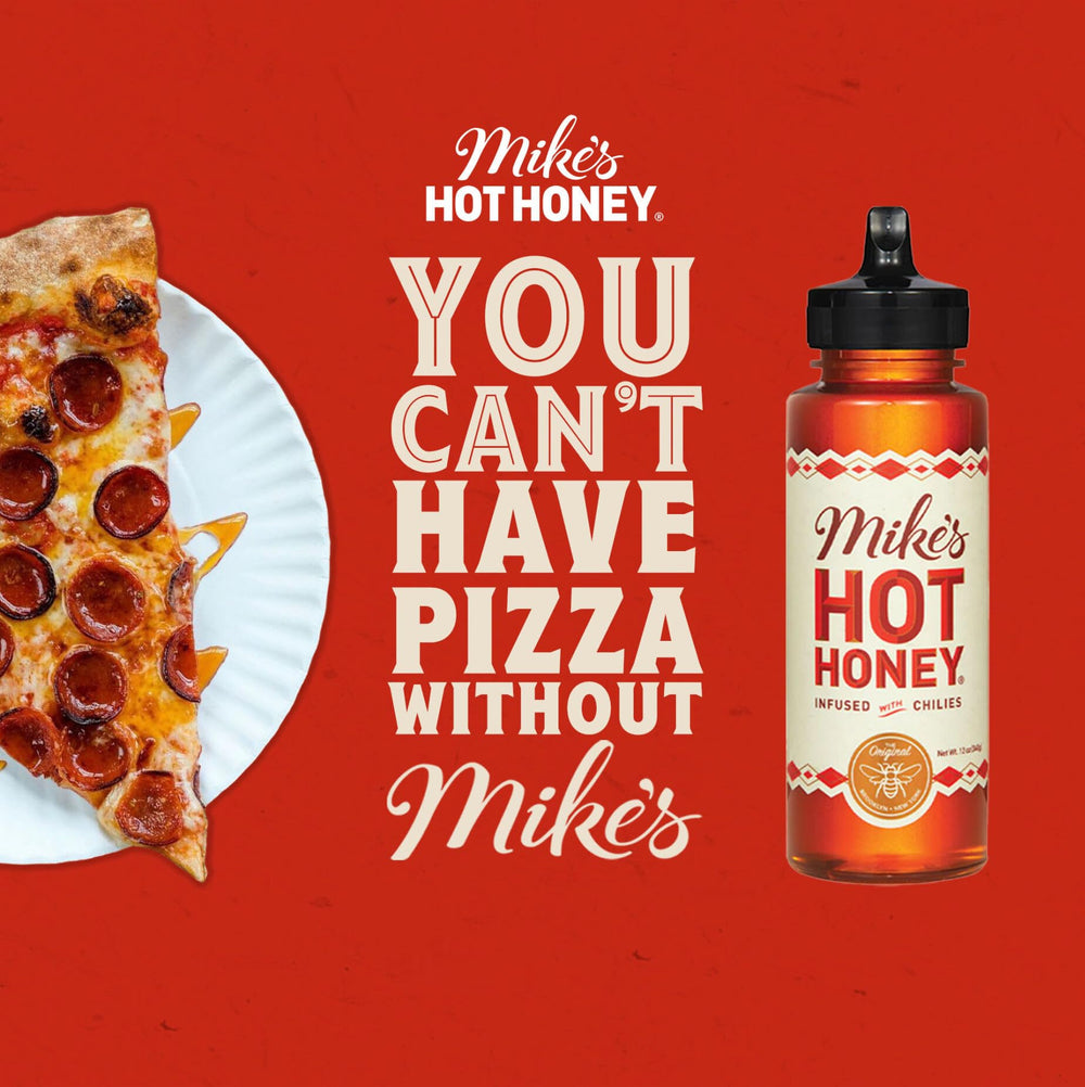 Mike's Hot Honey drizzle on a cheese board for balanced sweetness