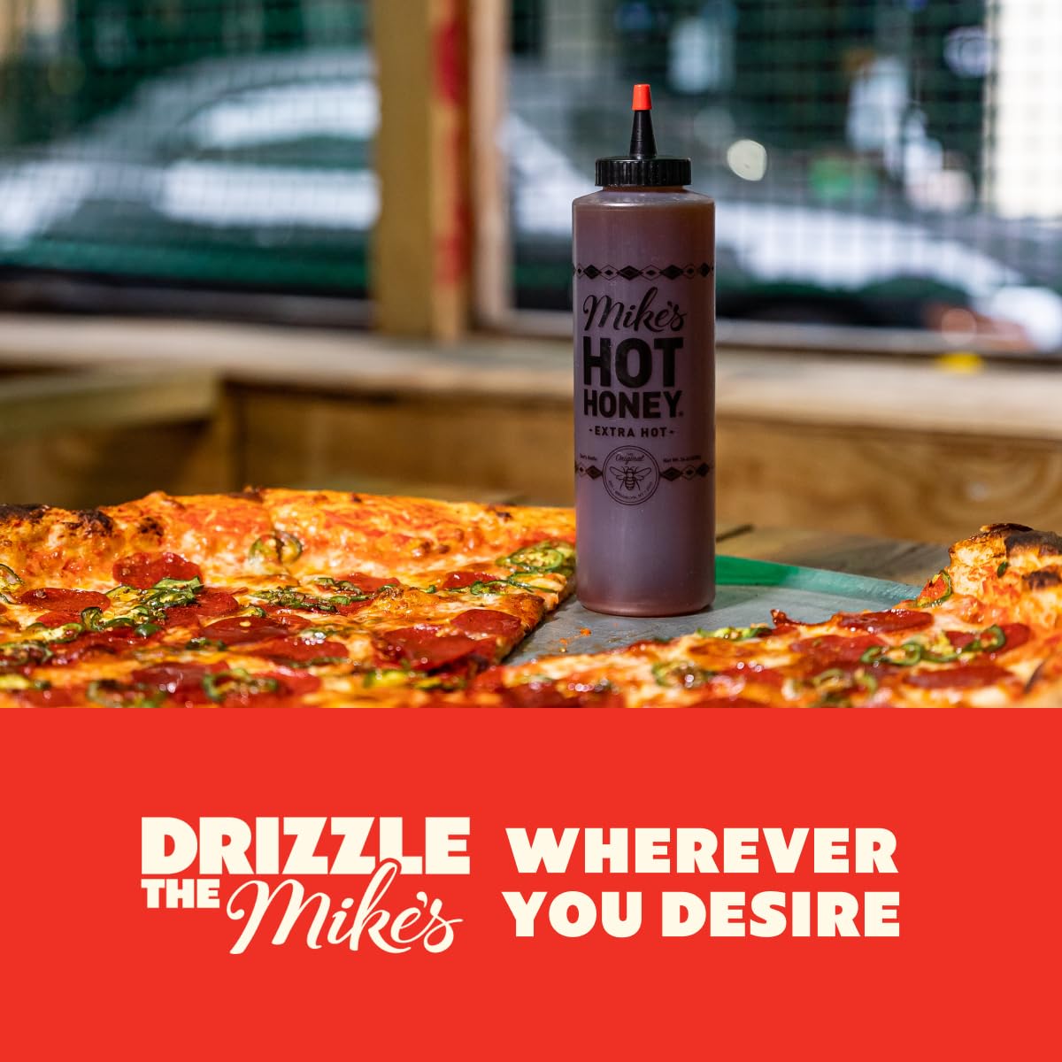 Kitchen scene with pizza and fried chicken suggests versatile pairings.