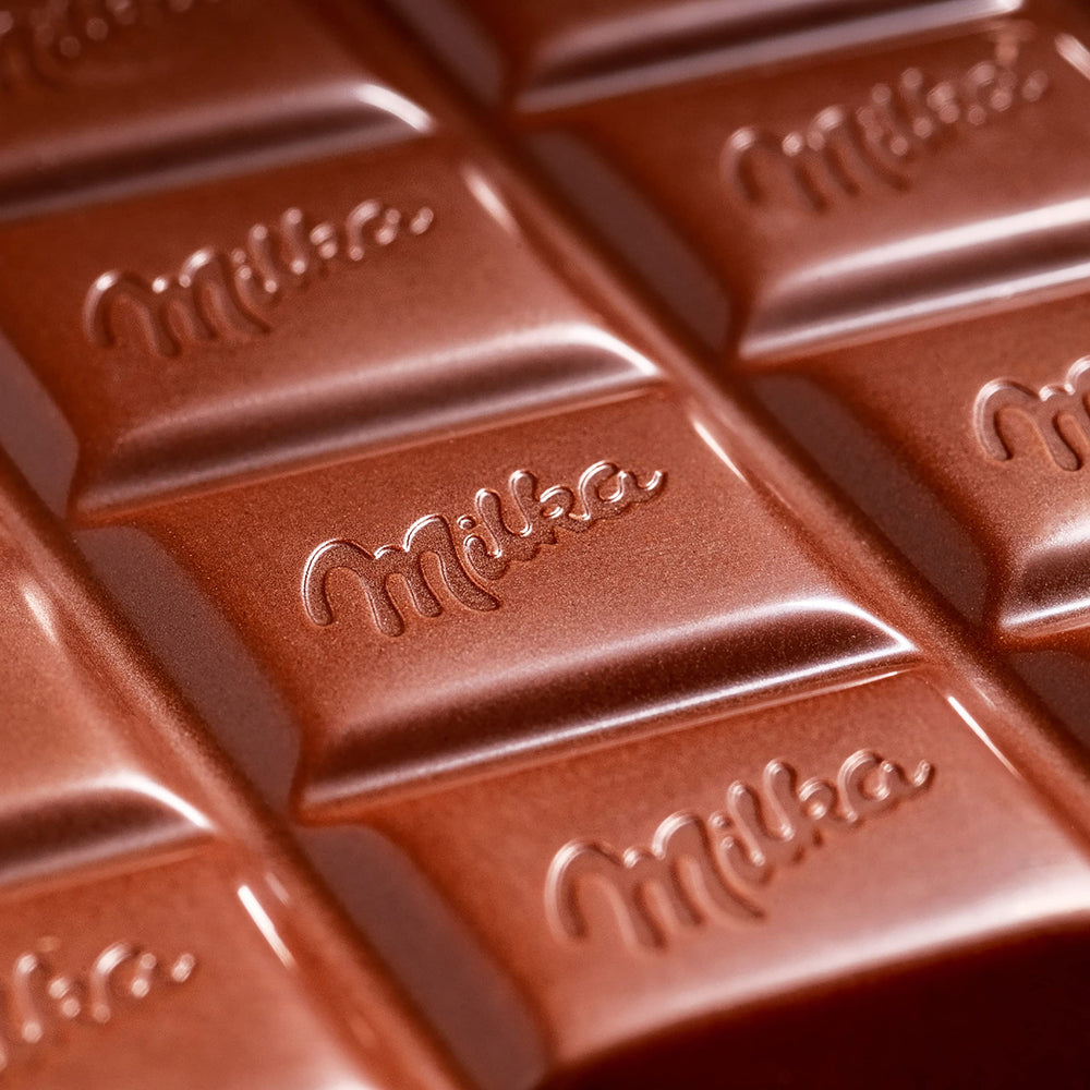 Milka Alpine Milk bar close-up melting texture in the mouth.