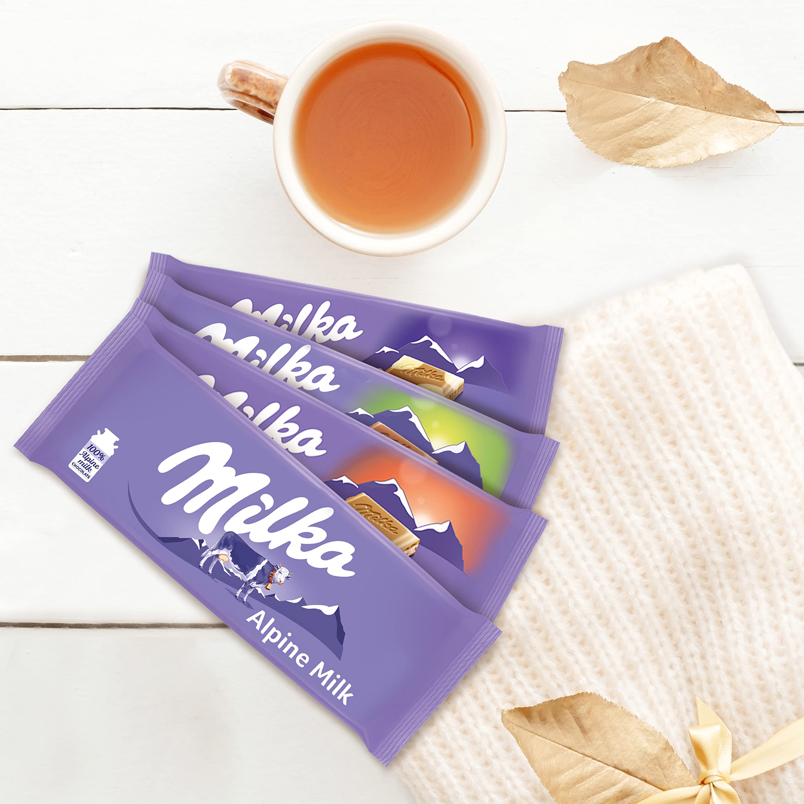 Milka Alpine Milk chocolate melting slowly, rich Alpine flavor.