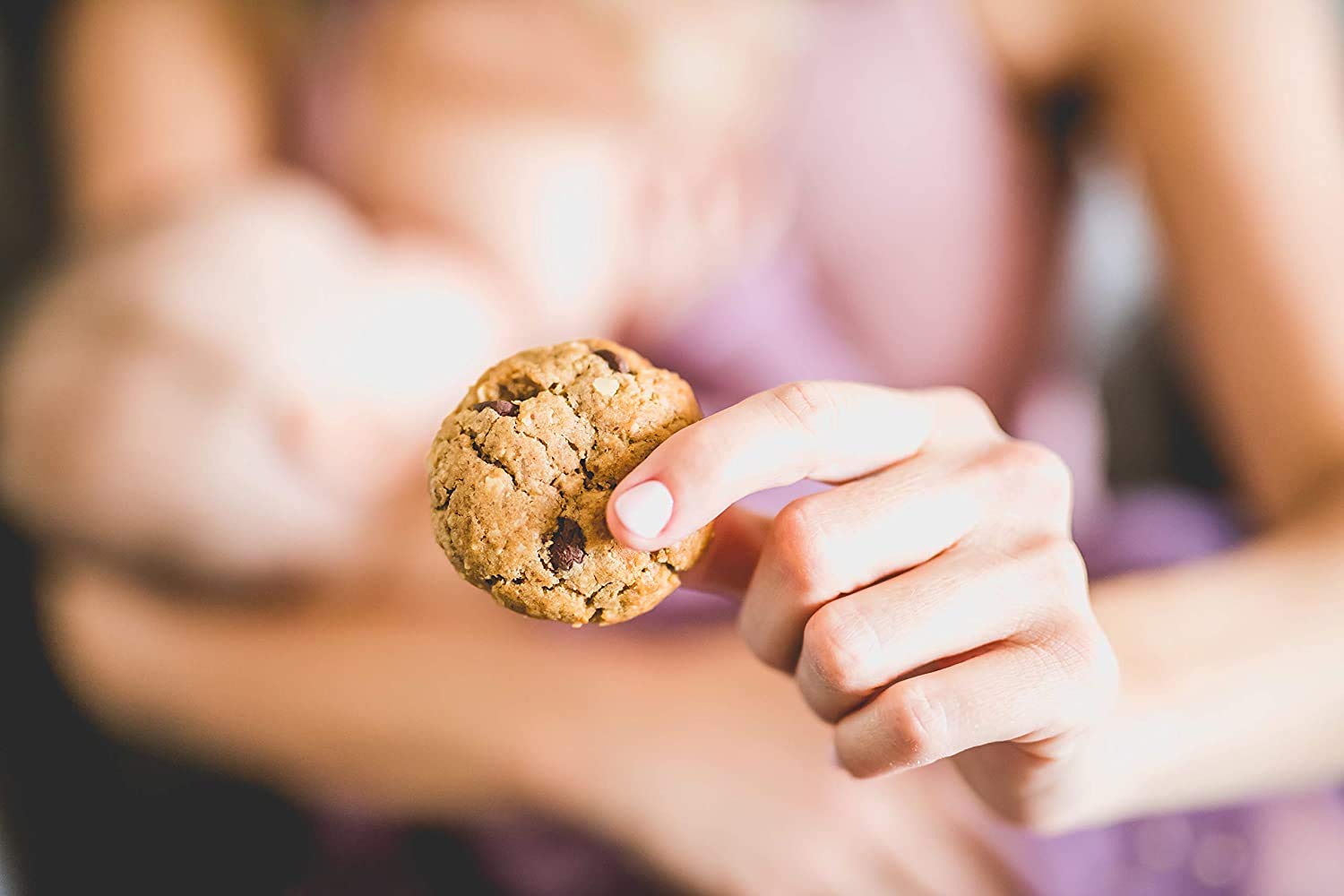 MilkBliss family enjoying cookies together during breastfeeding.