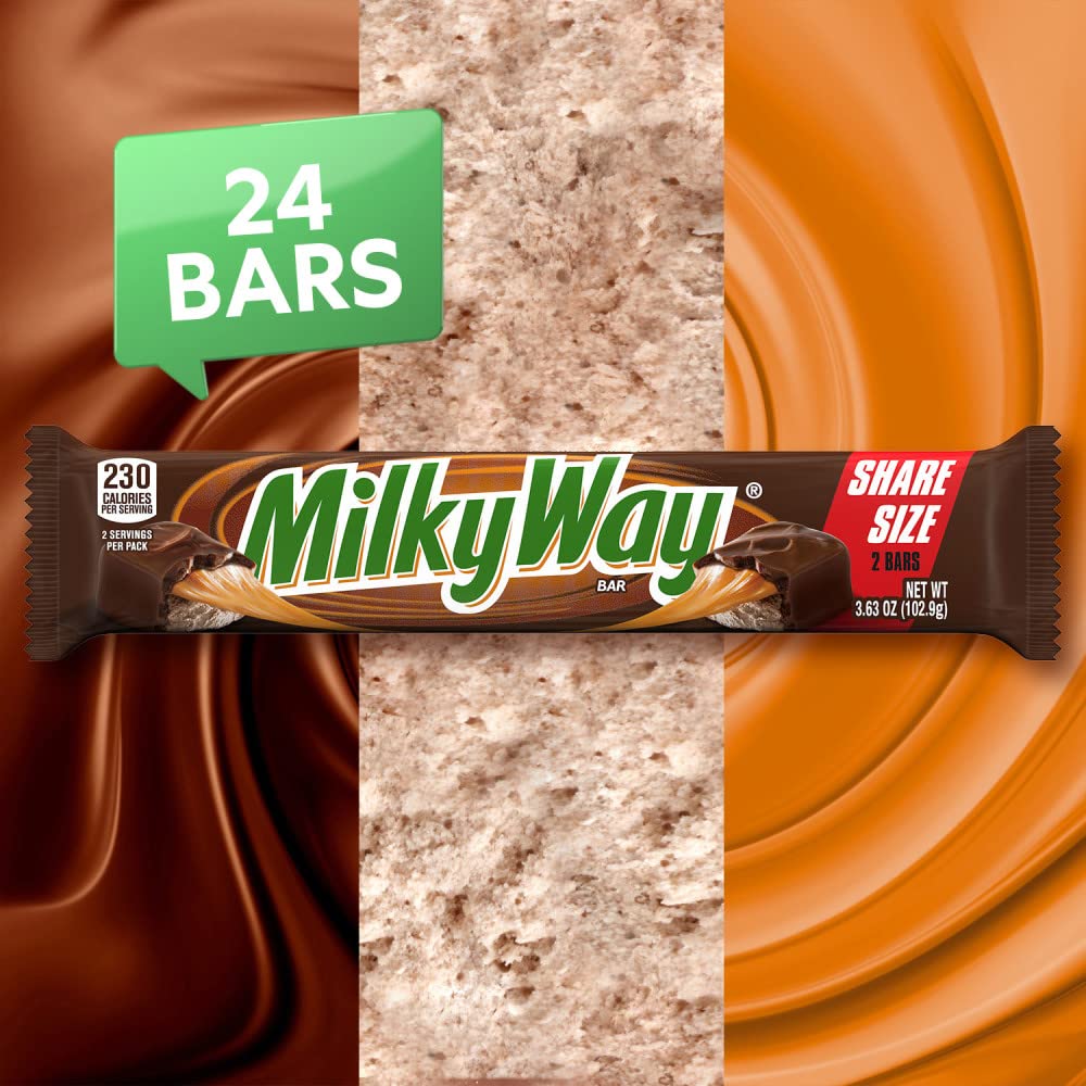 Milky Way milk chocolate coating close-up over caramel and nougat, rich chocolate flavor.