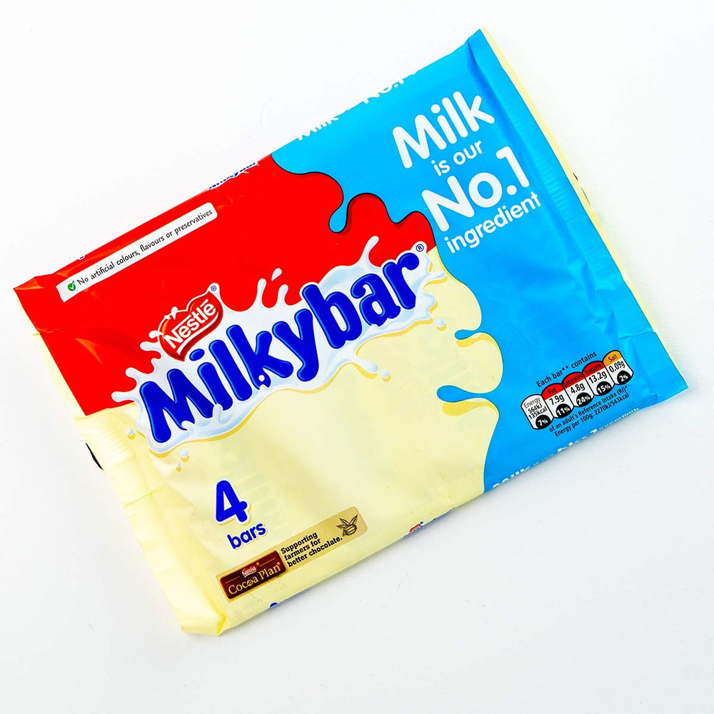 Close-up of MilkyBar creamy white bars highlighting smooth melt.