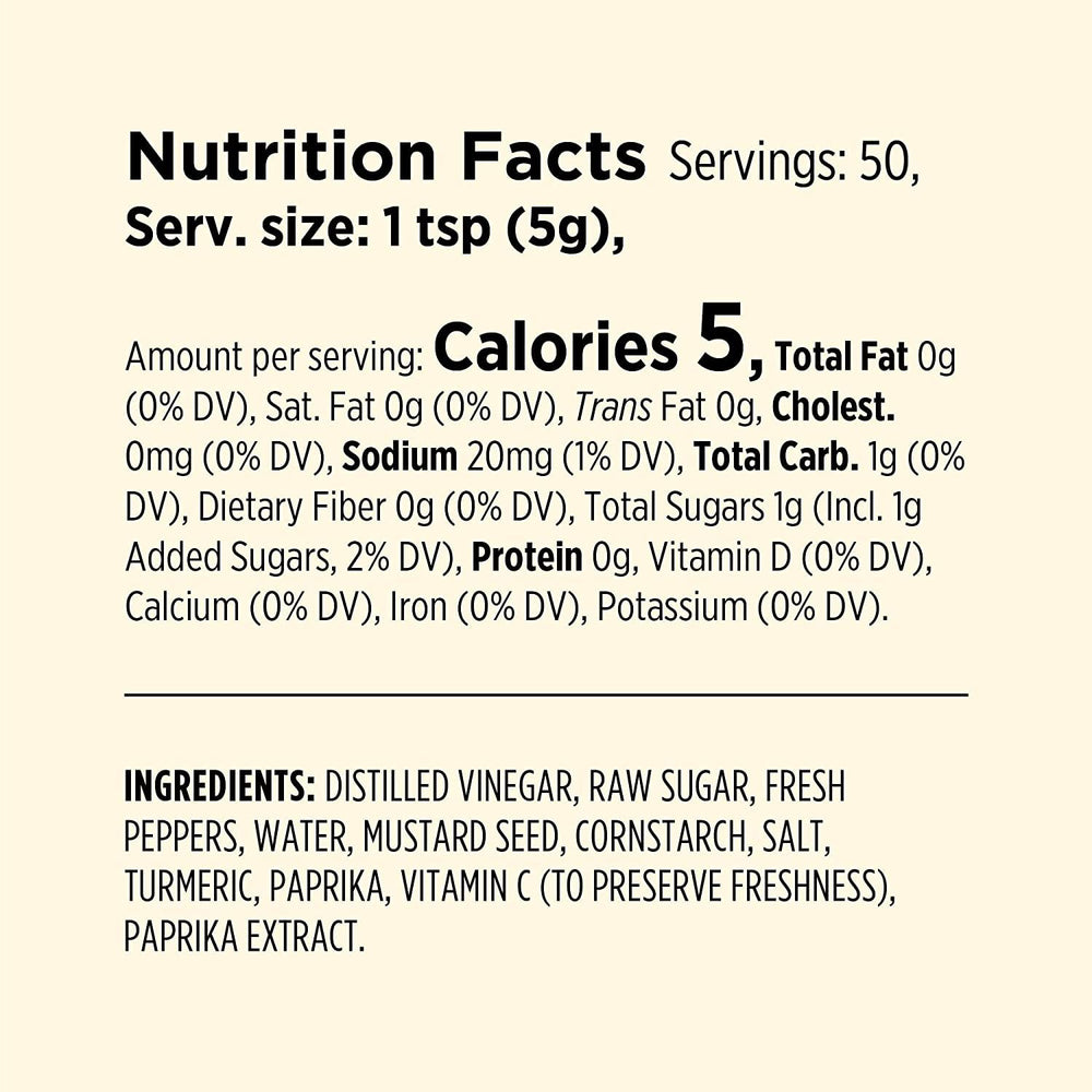 Millers Banana Pepper Mild Hot Sauce label closeup highlights its sweet-spicy profile.