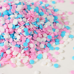 Milovin confetti sprinkles in pink, blue and white for cake decorating and dessert decoration.