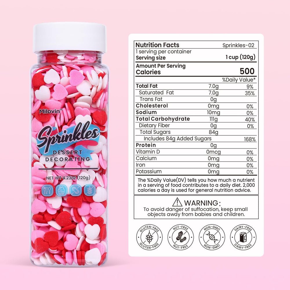 Milovin heart sprinkles in white pink and red on a cake for festive flair.