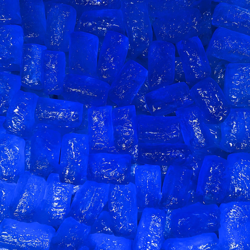 Colorful blue raspberry candies from MIMA MIMA, appetizing and flavorful.