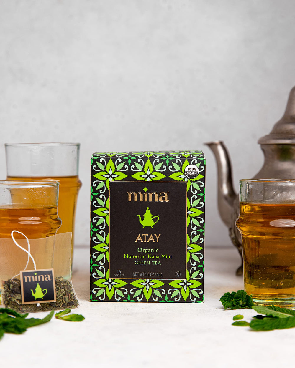 Mina Atay Moroccan Nana Mint cup with steam and mint notes.