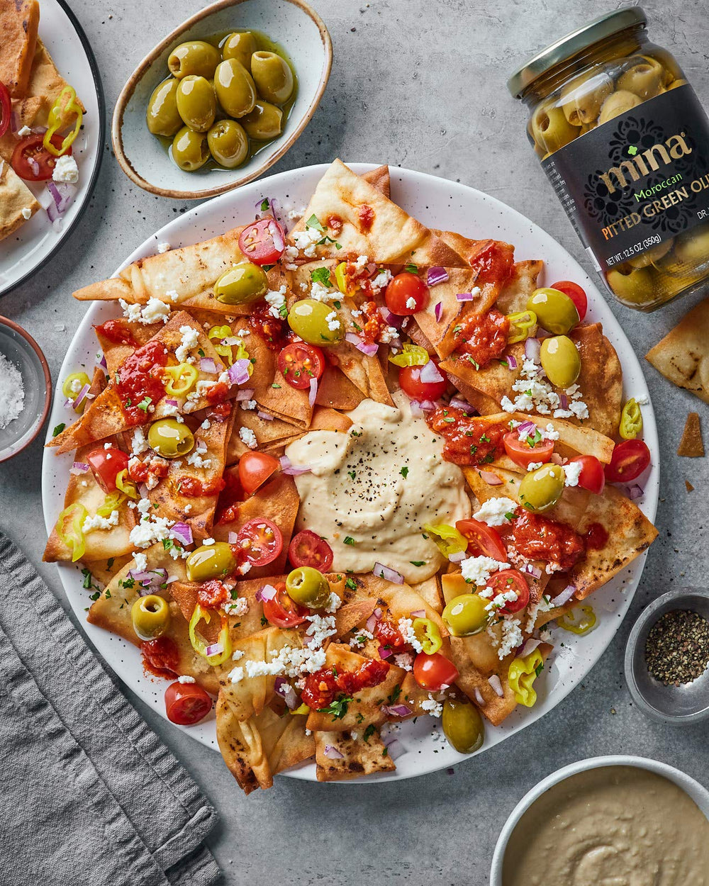 Mina Green Olives Pitted jar with natural sea salt, premium taste.