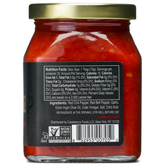 Mina Harissa hot sauce being poured for balanced heat on wings and eggs.