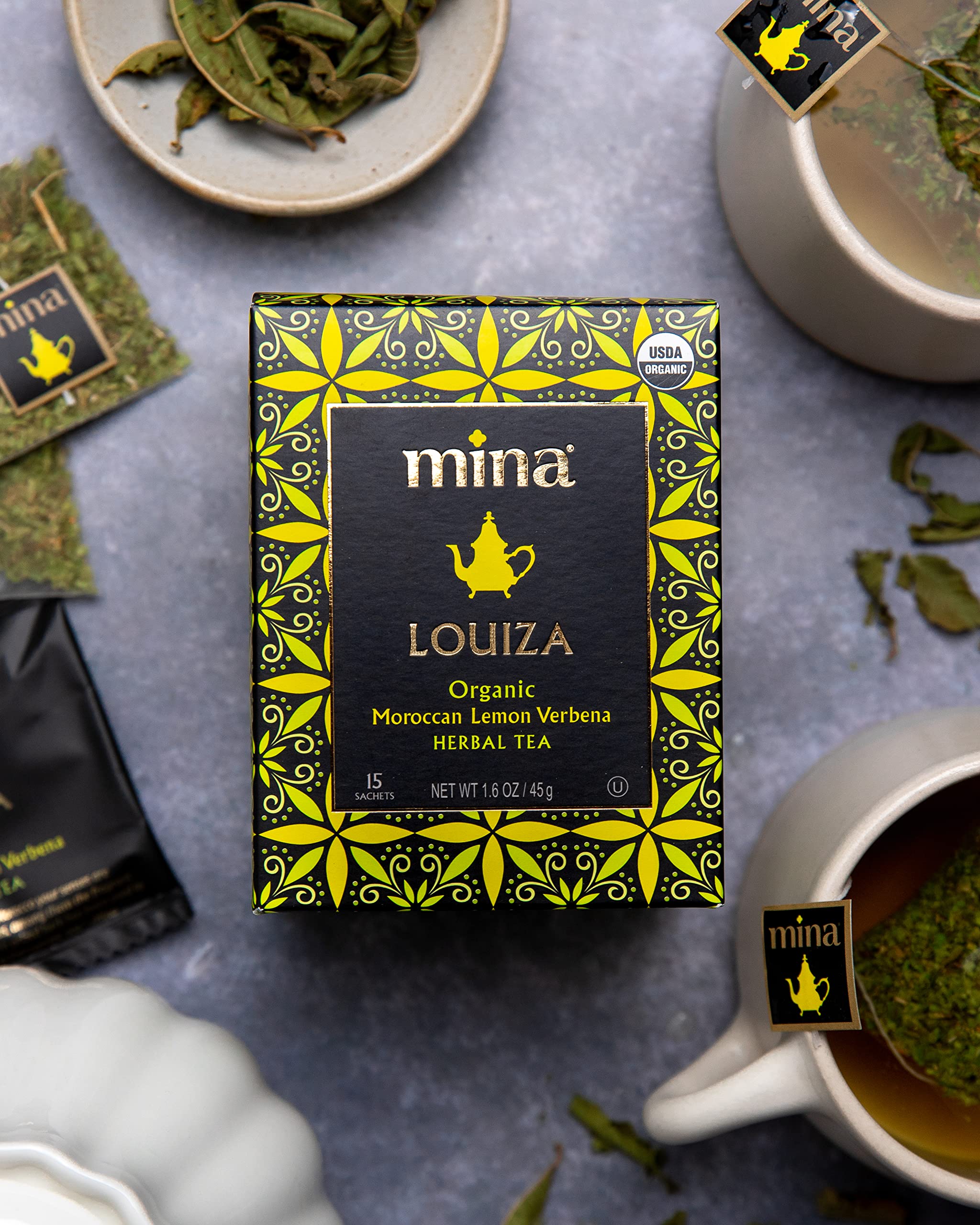 Mina Louiza biodegradable sachets organized for convenient hot or iced tea preparation.