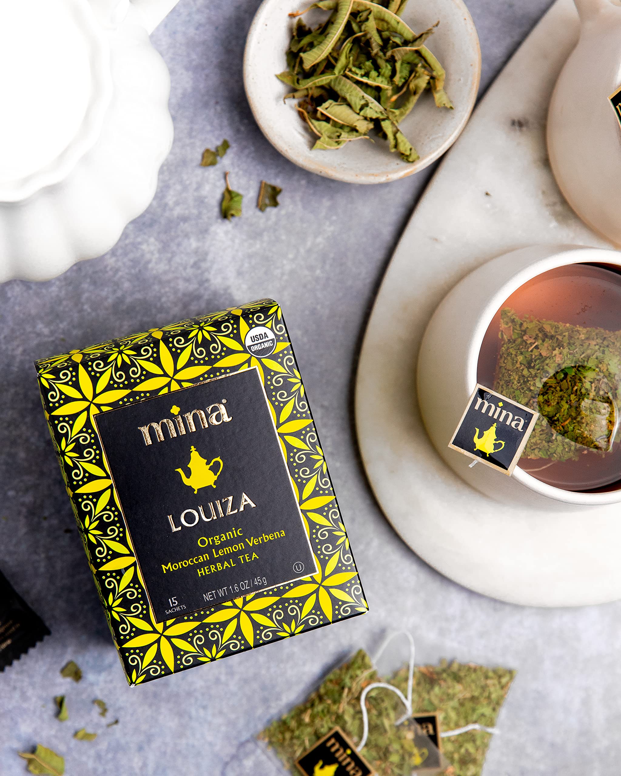 Mina Louiza lemon verbena tea steeping in glass evokes a refreshing afternoon ritual.