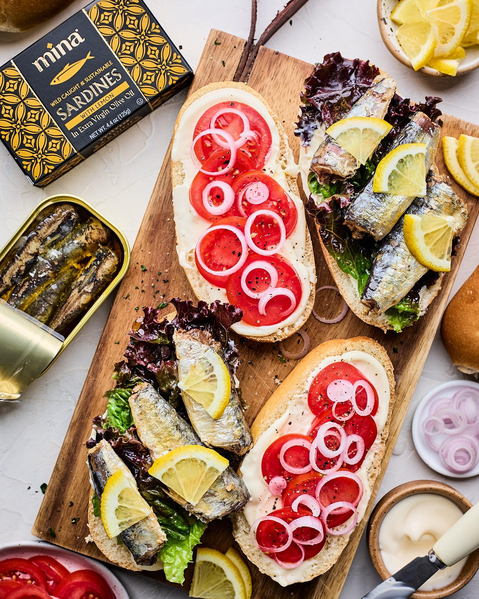 Mina Sardines pack of 12 cans stored in pantry.
