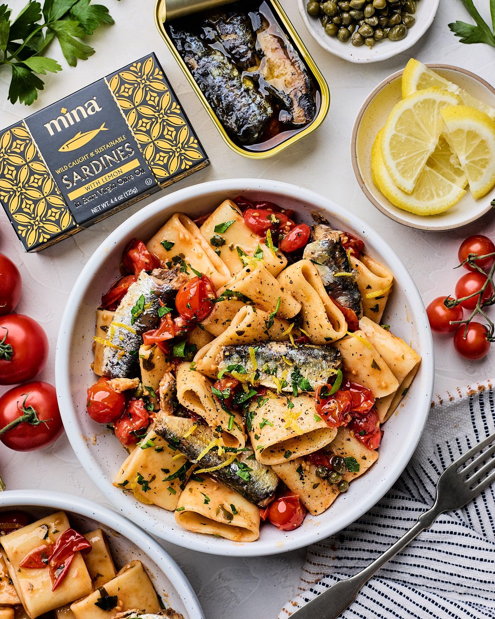 Mina Sardines on a fresh salad as a protein topping.