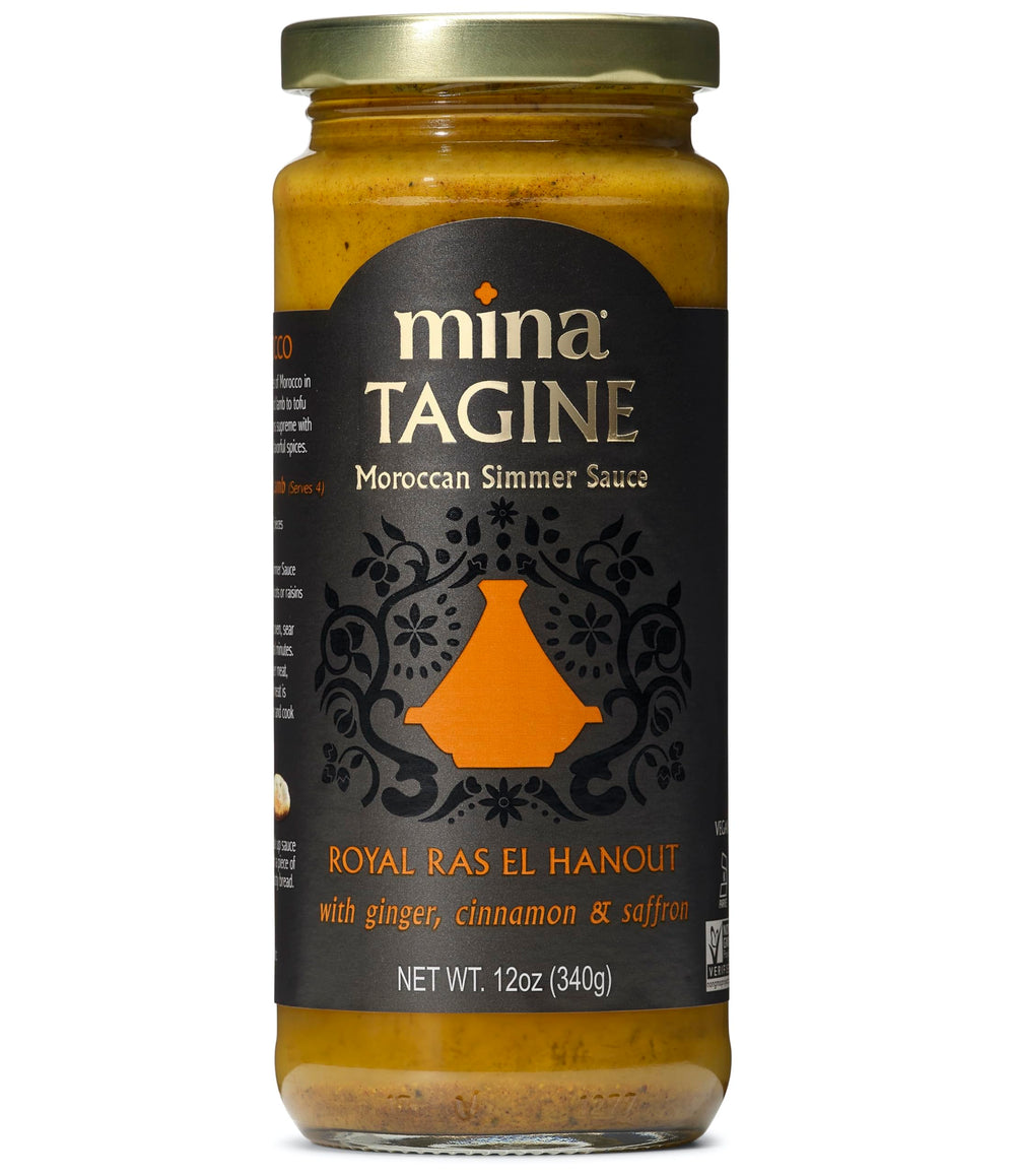 Mina Tagine Sauce bottle being poured for rich Moroccan flavor.