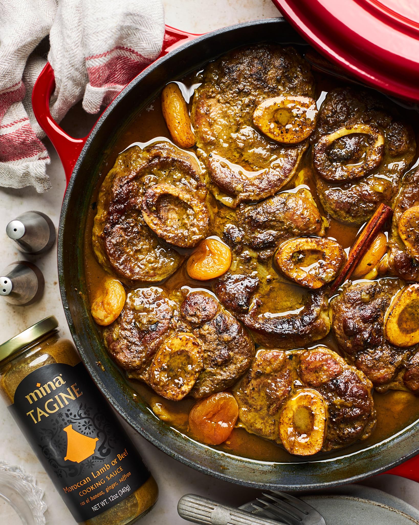 Mina Tagine Sauce served over couscous for Moroccan fusion.
