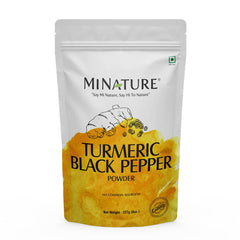 Minature turmeric root powder bottle with black pepper for versatile cooking.