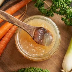 Gelatin powder dissolving in liquid to create smooth textures in recipes.