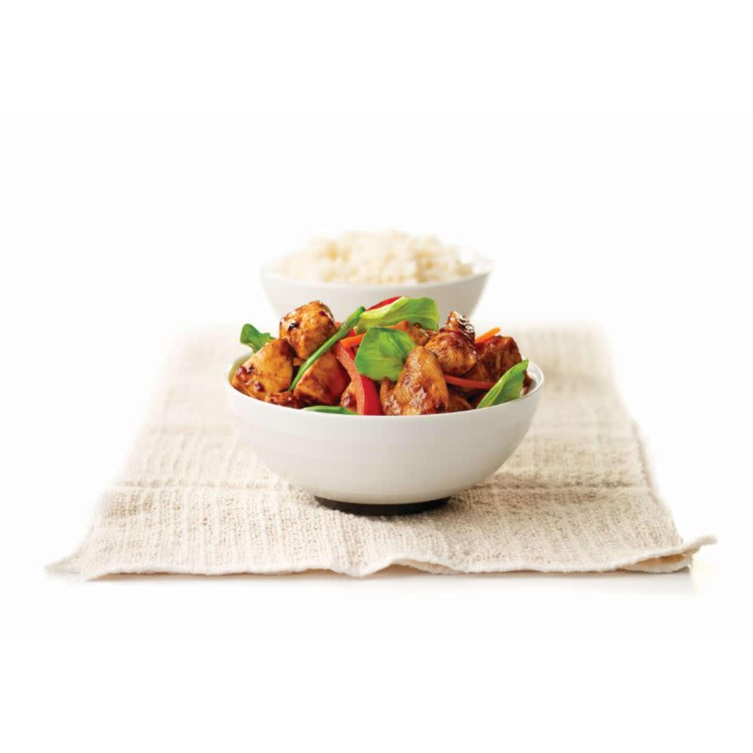 MINOR'S sauce glazes a sizzling stir-fry dish to enhance flavor during cooking.