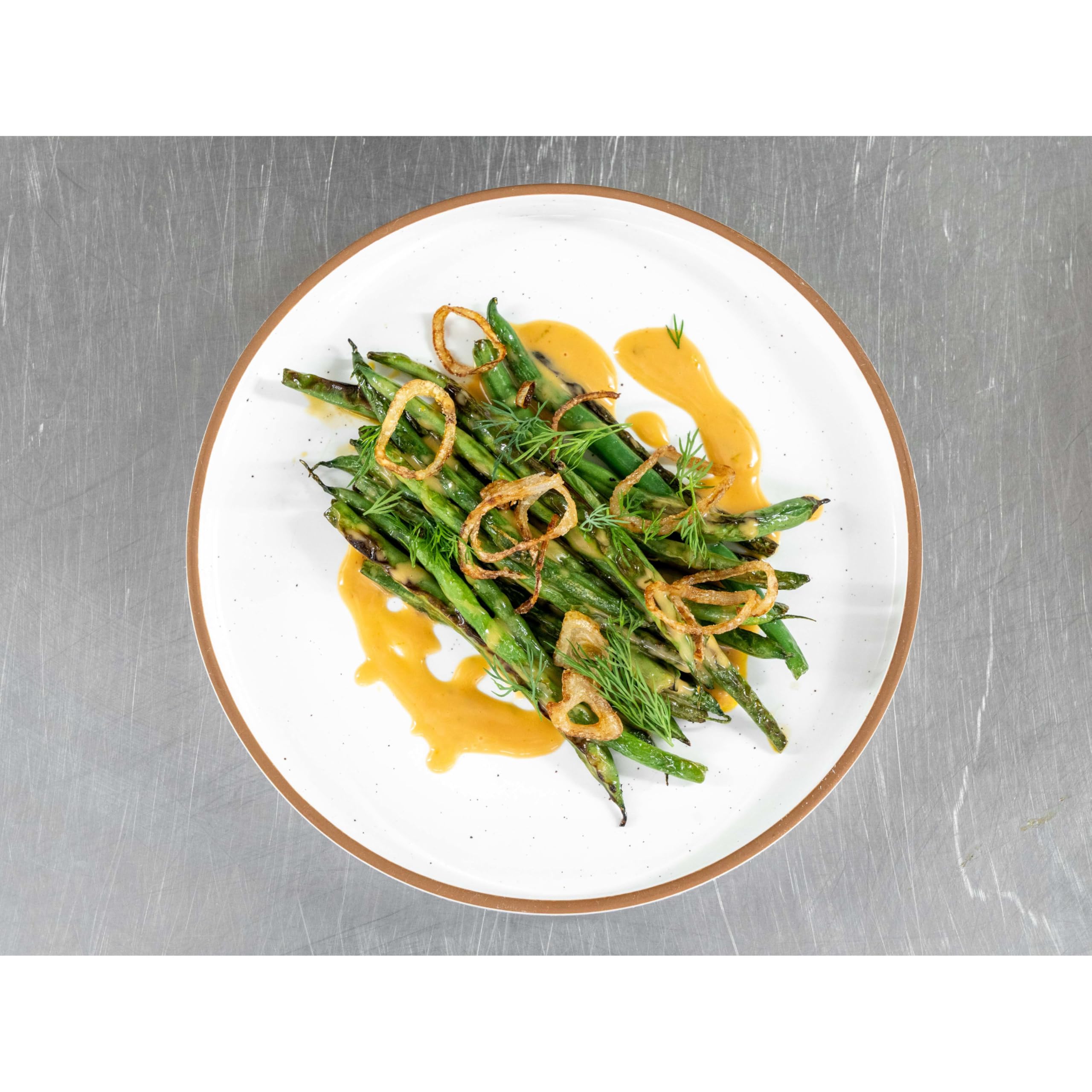 MINOR'S Zesty Orange Sauce on noodles delivers glossy citrus coating