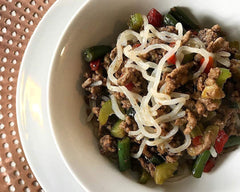Miracle Noodle Organic angel hair pasta served on plate, light texture with sauce absorption.