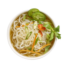 Cooked Miracle Noodle Pho Shirataki in a steaming pho bowl.