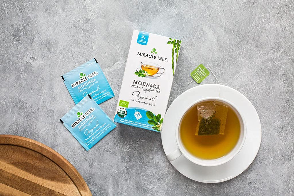 Miracle Tree Moringa Tea hot cup brew — aromatic infusion in minutes.