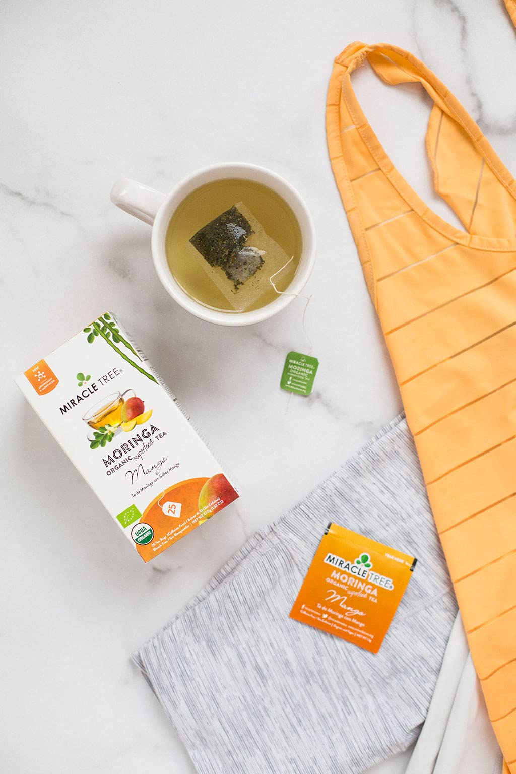 Miracle Tree Moringa Mango on-the-go sachets for travel-friendly tea.