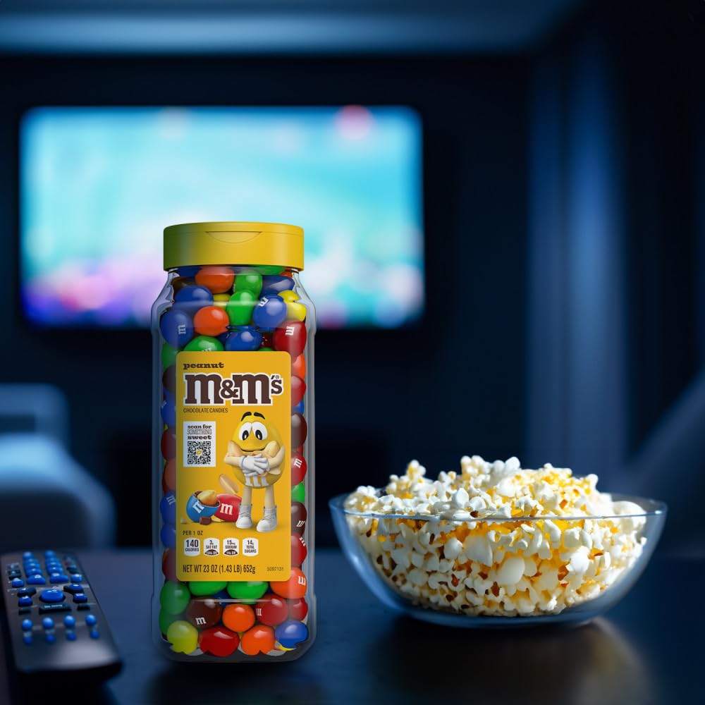 M&M's bulk candy jars on a party table for sharing.
