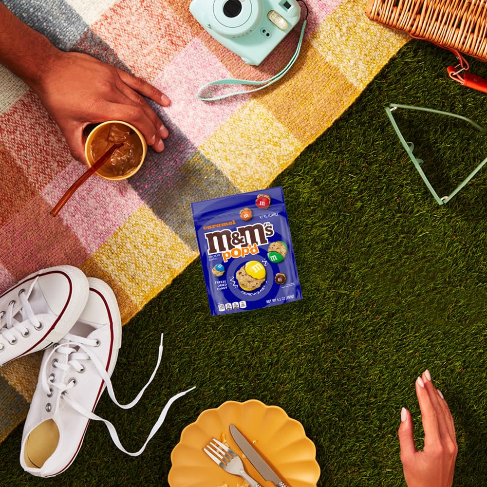 M&M'S Pop'd Caramel milk chocolate core visible amidst airy crunch.