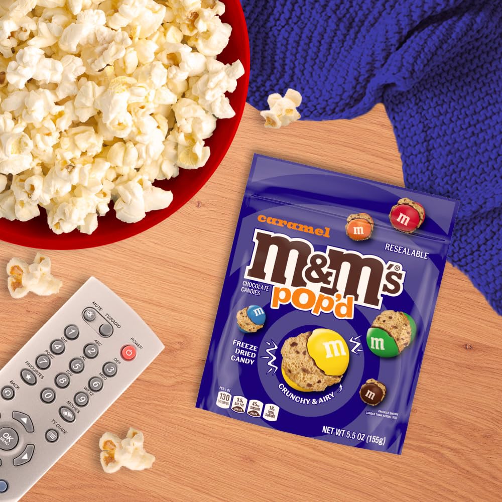M&M'S Pop'd Caramel movie-night snack setup beside popcorn.