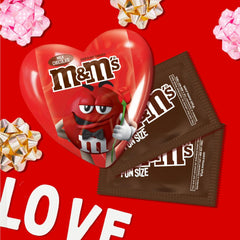 M&M'S box pairs with roses for a sweet desk centerpiece.
