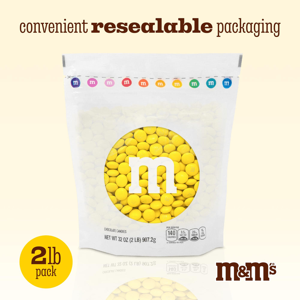 M&M’S World party favors setup with bulk candy in jars.