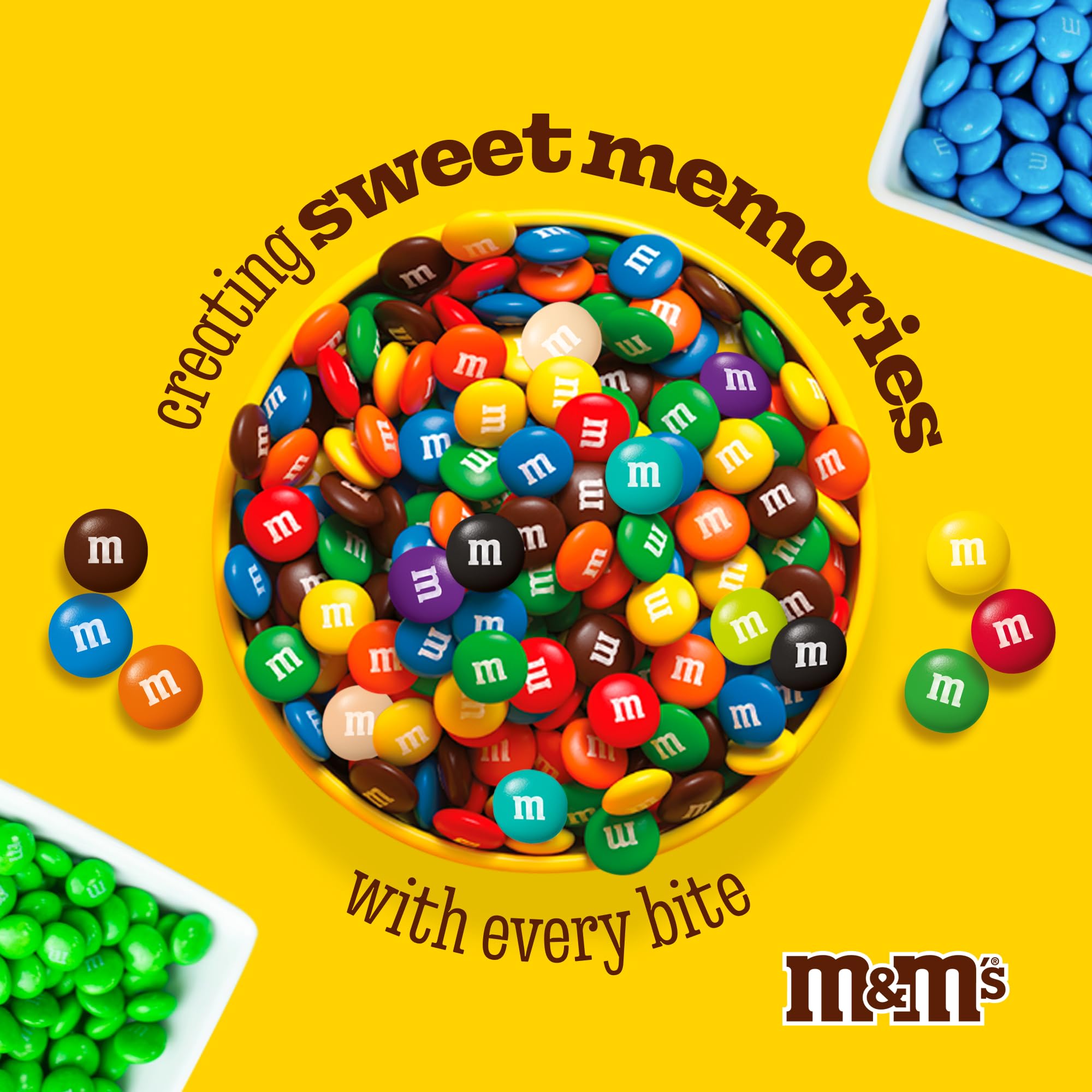 M&M'S WORLD white milk chocolate candy on a wedding dessert table for color and charm.